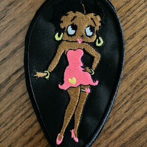 Black Betty Boop embroidered patch donning usual skimpy pink dress and shoes